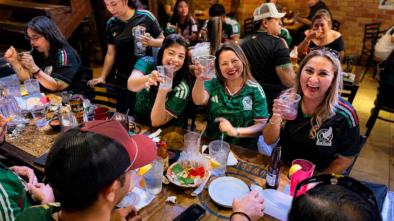 Guests raising their glasses during an energetic on-premise brand experience