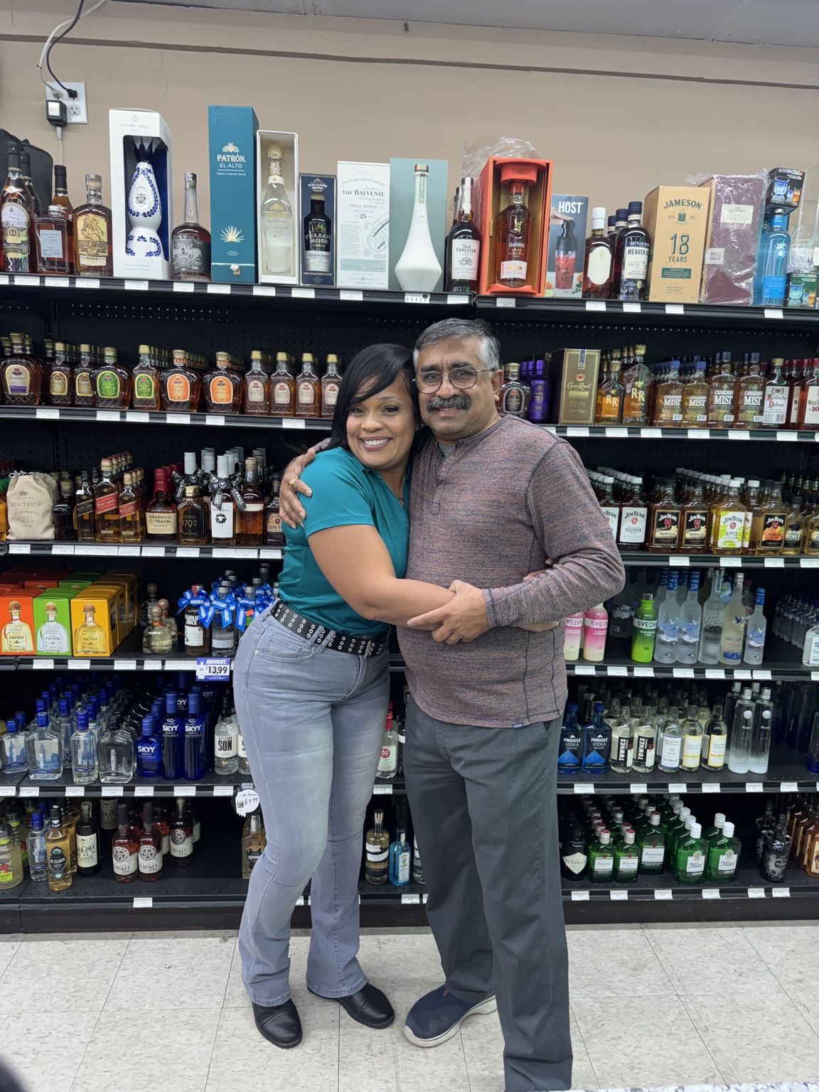 Nice Girl Promotions founder with a store owner after a tasting